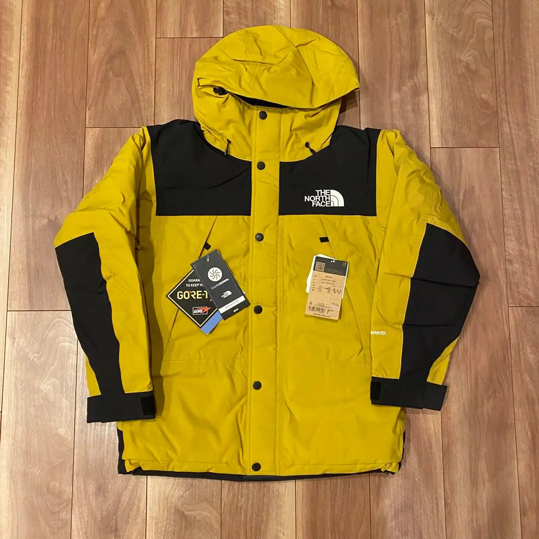 Brand new, unused The North Face Mountain Down Jacket, size M, yellow