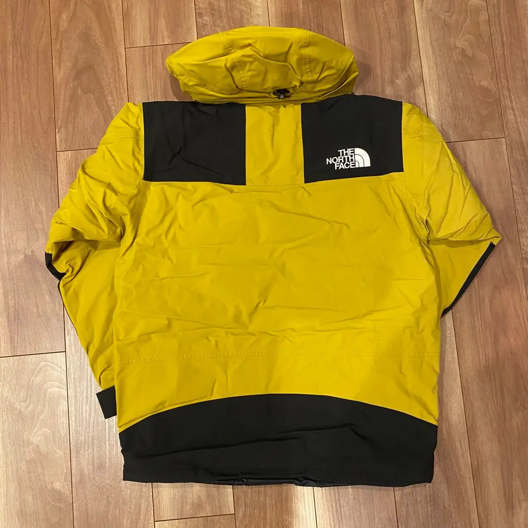 Brand new, unused The North Face Mountain Down Jacket, size M, yellow