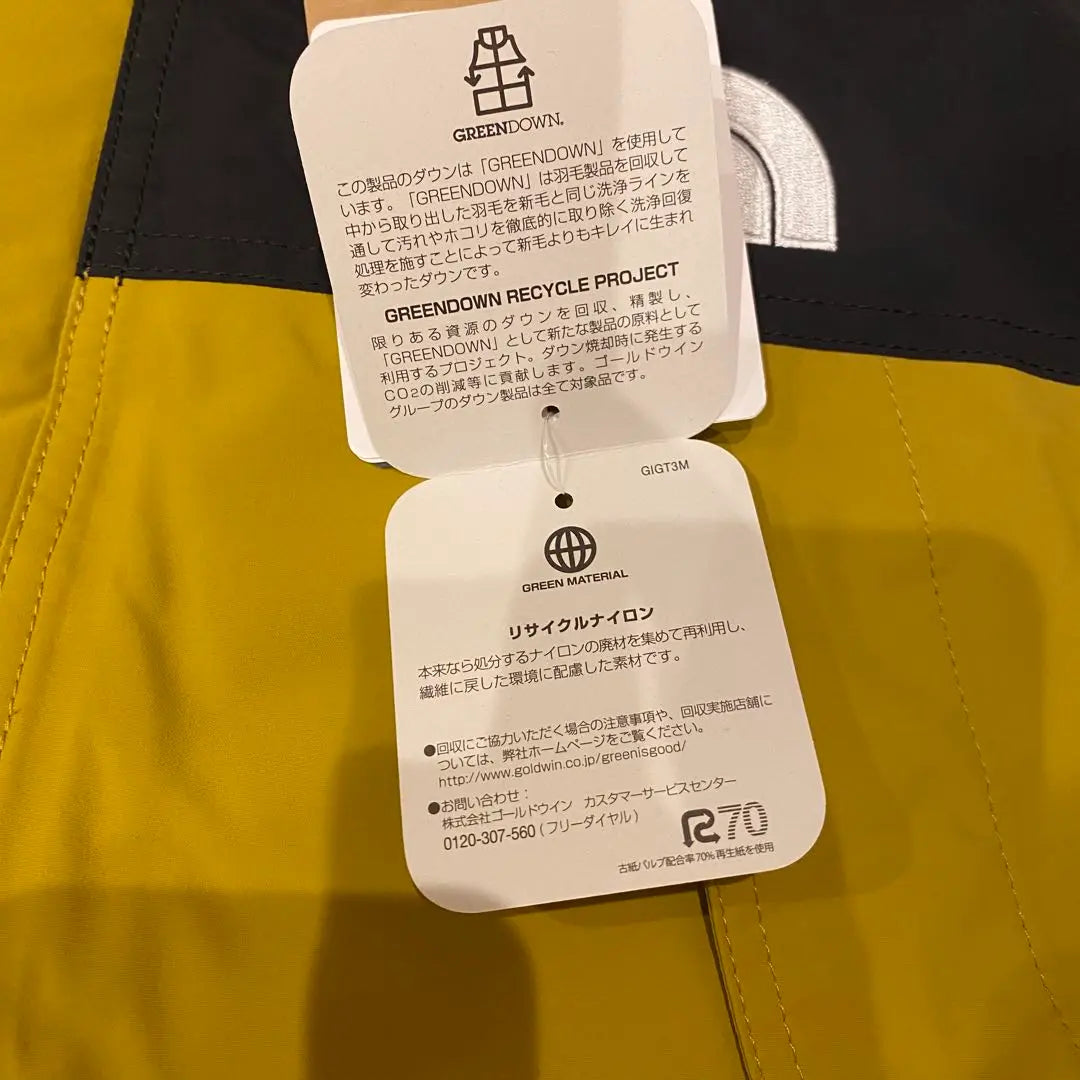 Brand new, unused The North Face Mountain Down Jacket, size M, yellow