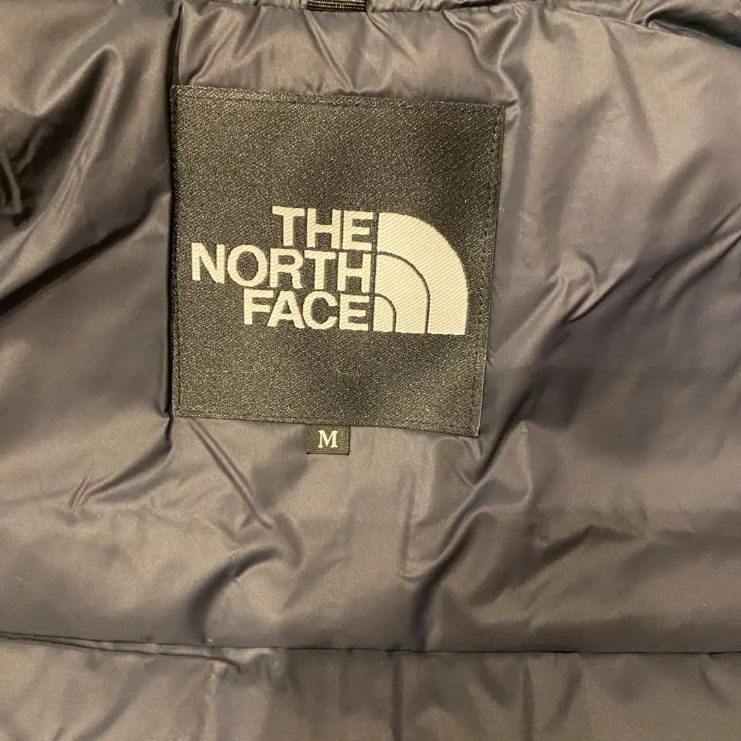 Brand new, unused The North Face Mountain Down Jacket, size M, yellow