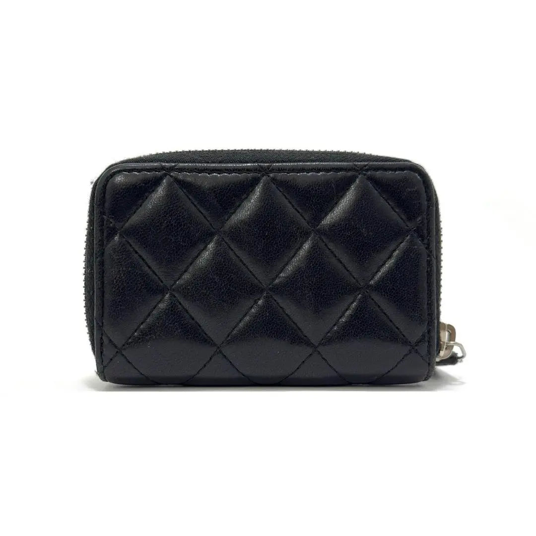 Monedero mini Chanel Coin Case de piel de cordero negra Matelasse