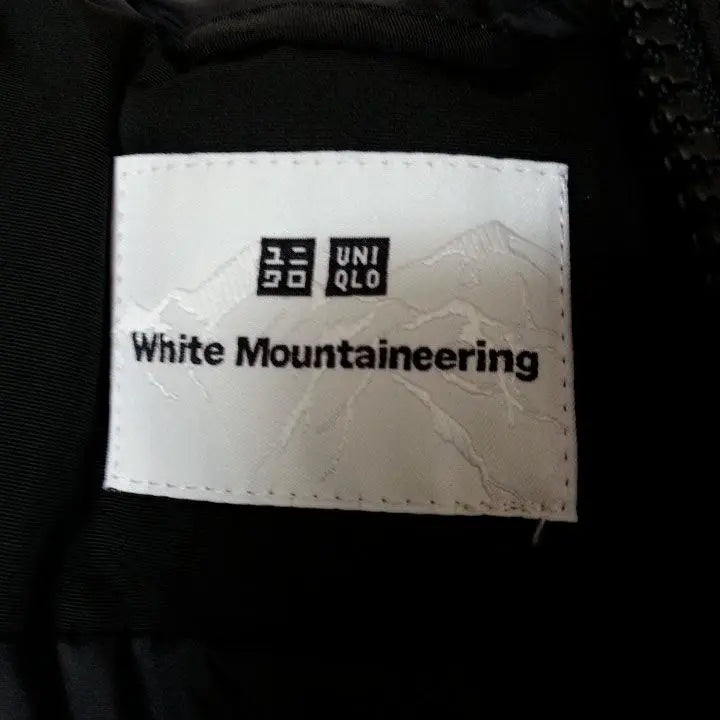 Parka híbrida de plumón de gran tamaño de color blanco para montañismo de UNIQLO