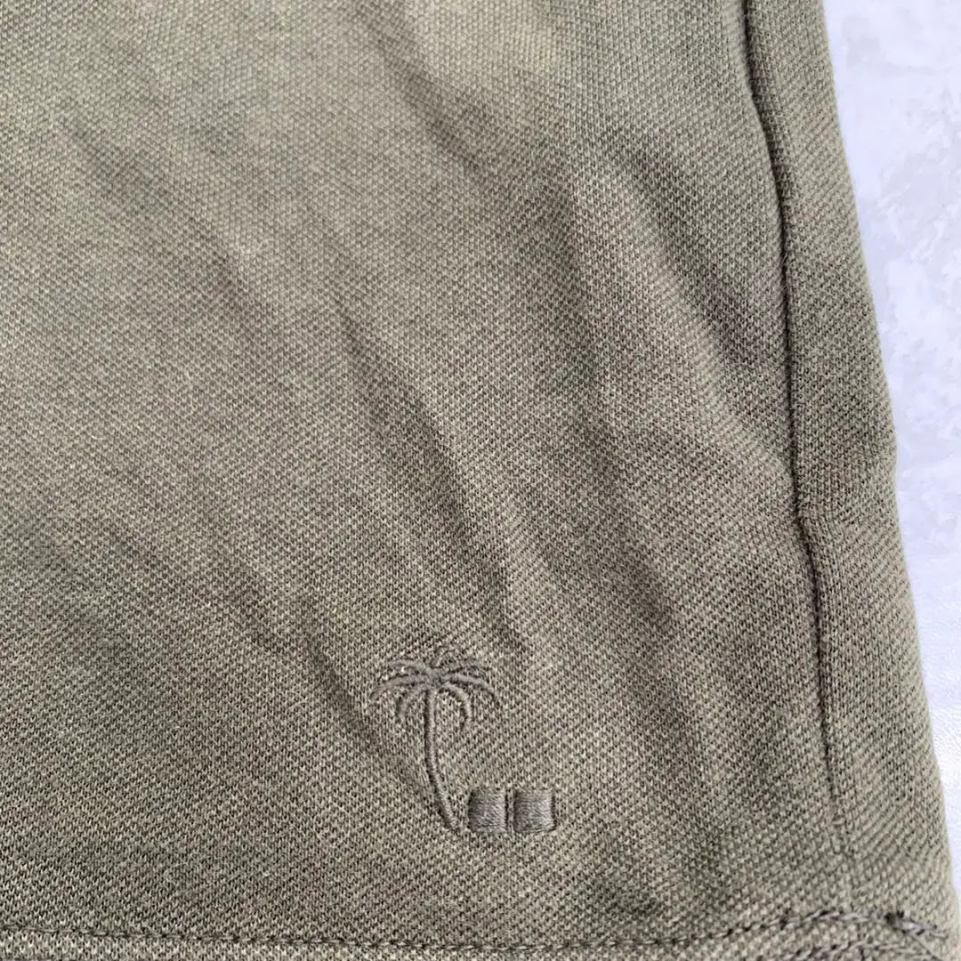 Polo Uniqlo Thomas Meyer liso verde oliva oscuro manga corta talla XL