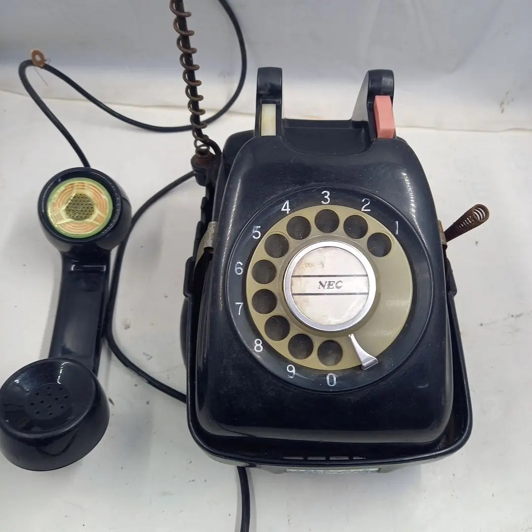 Dial type black telephone with rotating stand