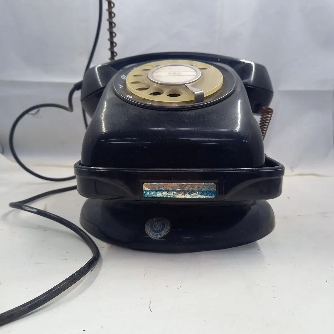 Dial type black telephone with rotating stand