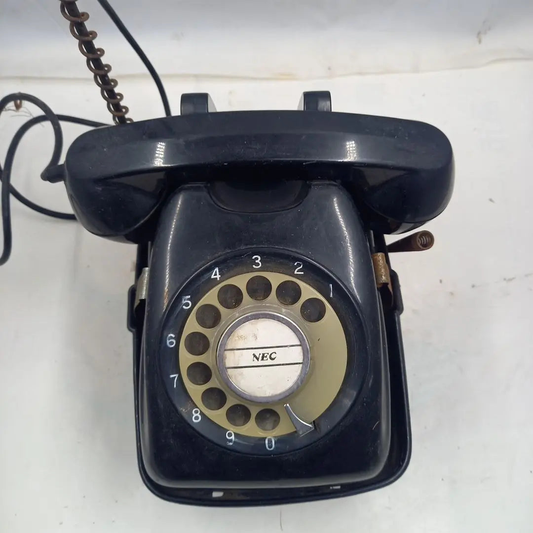 Dial type black telephone with rotating stand