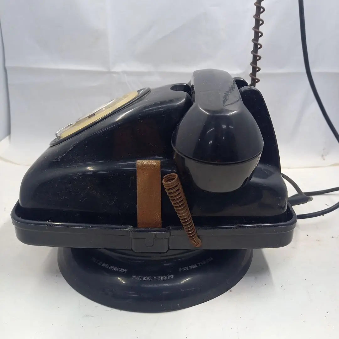 Dial type black telephone with rotating stand