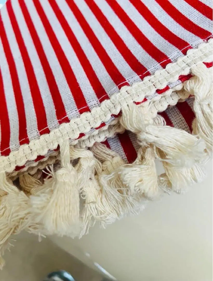 New red and white striped tablecloth with fringe