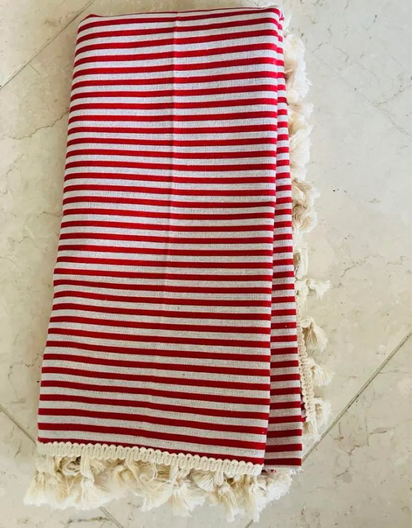 New red and white striped tablecloth with fringe