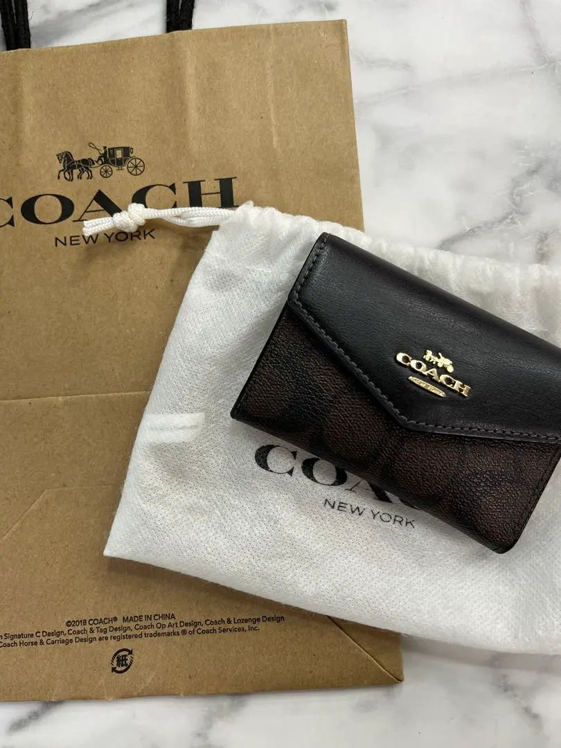 coach card case signature