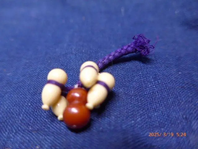 This is a keychain with a lucky gourd made from bell be rebuilt.