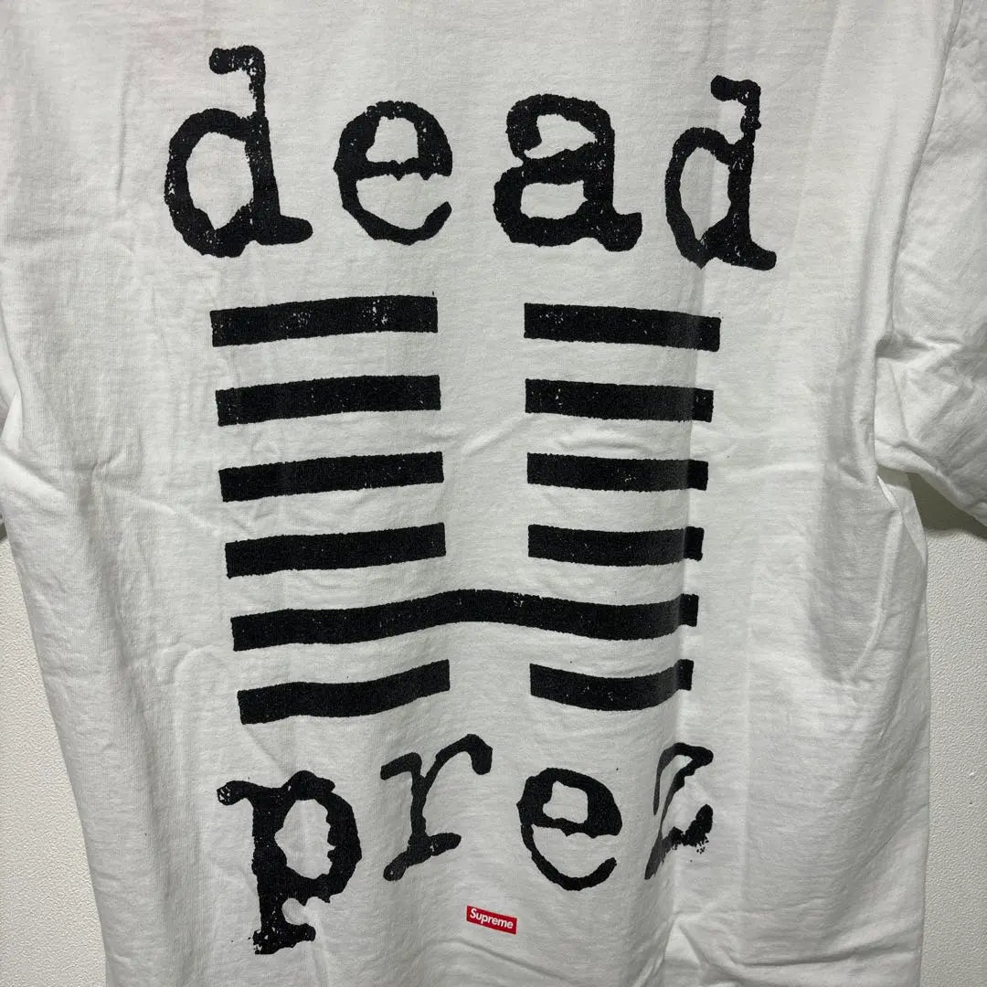 Camiseta Suprema Suprema 19aw Dead Prez Dead Su | SUPREMO シュプリーム 19AW dead prez Tee デッドプレズ