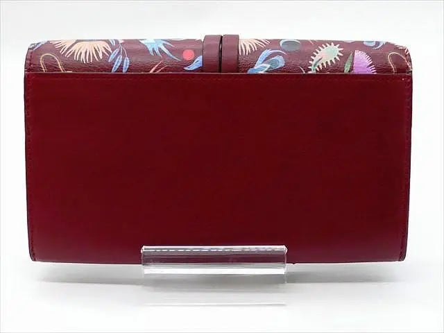 [1581] Cartera larga *Chloe* sin usar, estampado floral, botón a presión, caja incluida