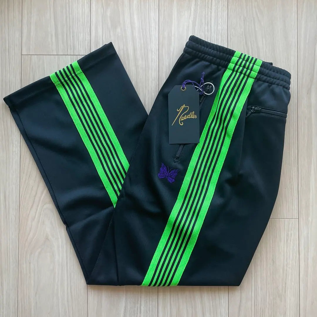 Brand new, unused needles track pants, black, light green