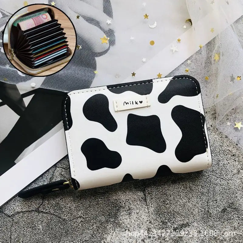 Cartera para mujer con tarjetero compacto de gran capacidad y diseño de vaca en color blanco y negro