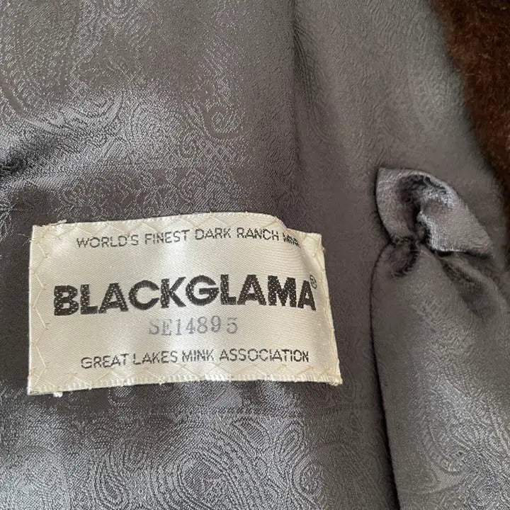 Brand new, unused BLACK GLAMA mink fur coat