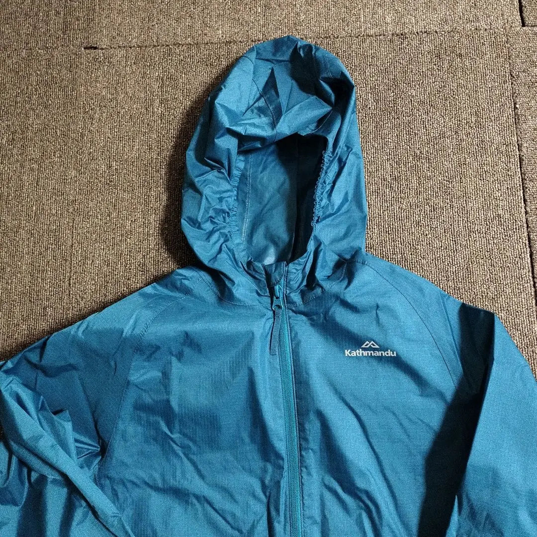 Kathmandu Hooded rain jacket not available in Japan Blue