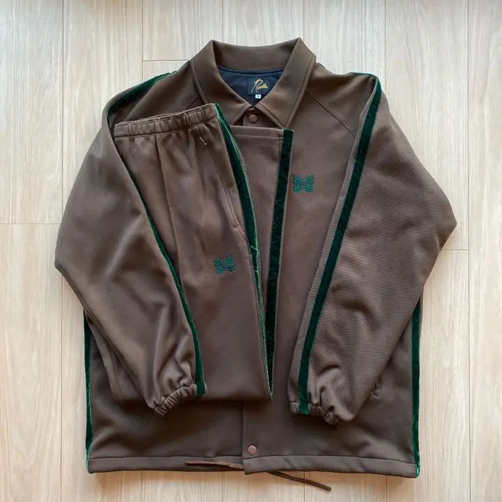 needles set up green brown track pants