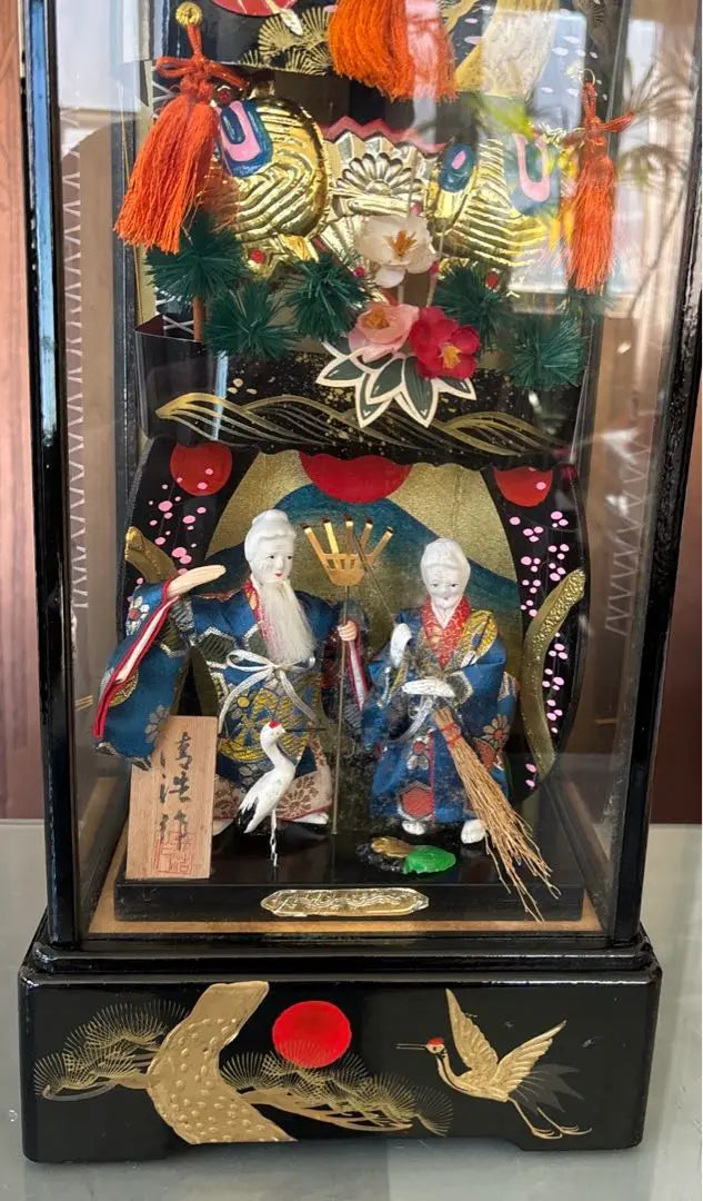 Japanese traditional decorations included in a glass case