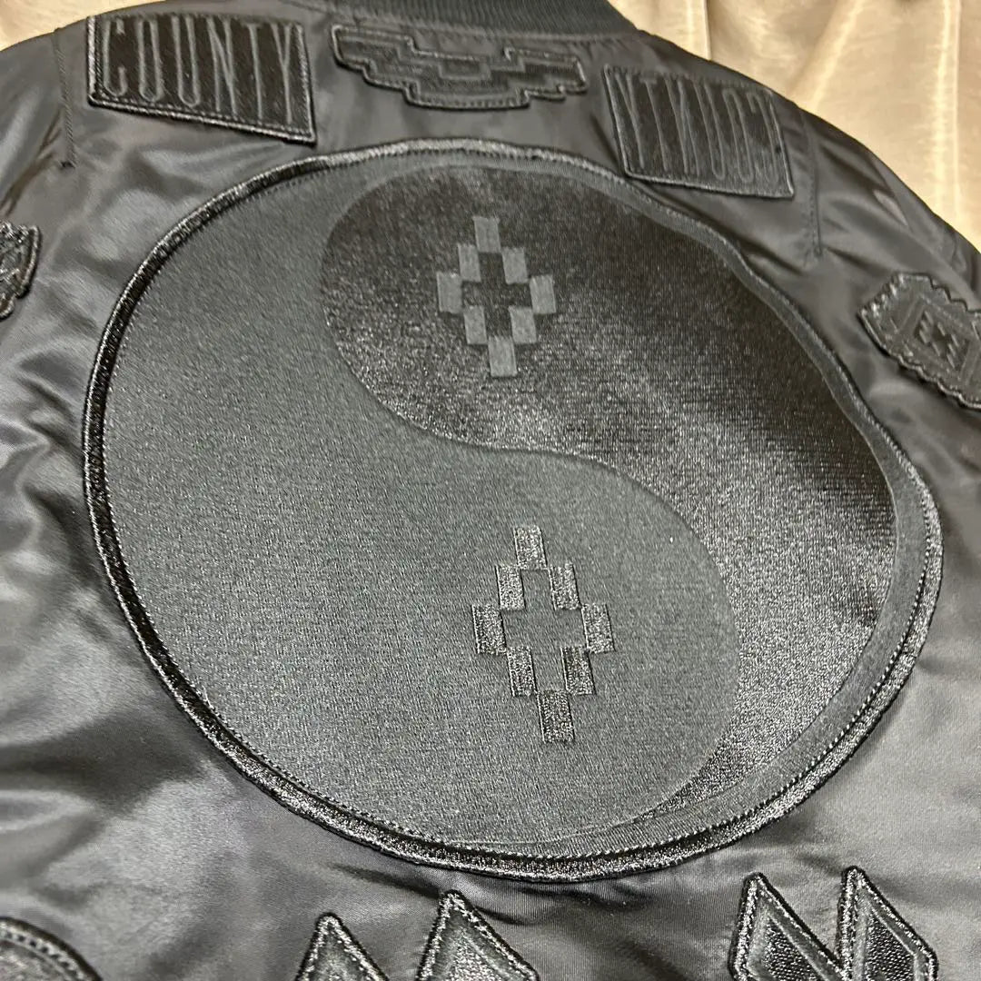 MARCELO BURLON ALPHA patch bomber jacket