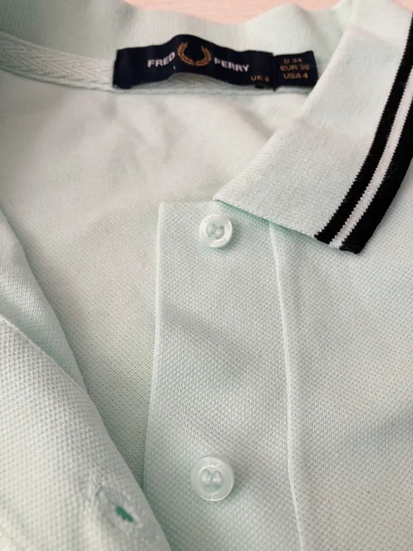 Polo de golf elástico de manga corta Fred Perry en verde menta