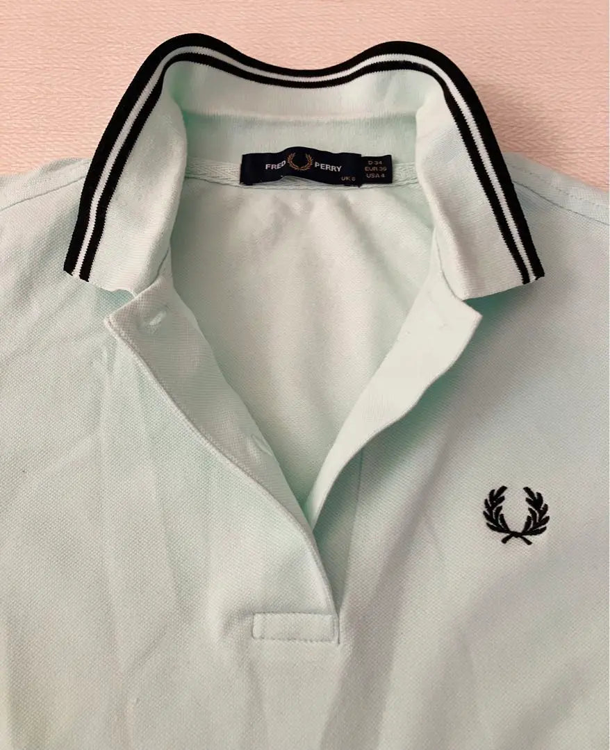 Polo de golf elástico de manga corta Fred Perry en verde menta