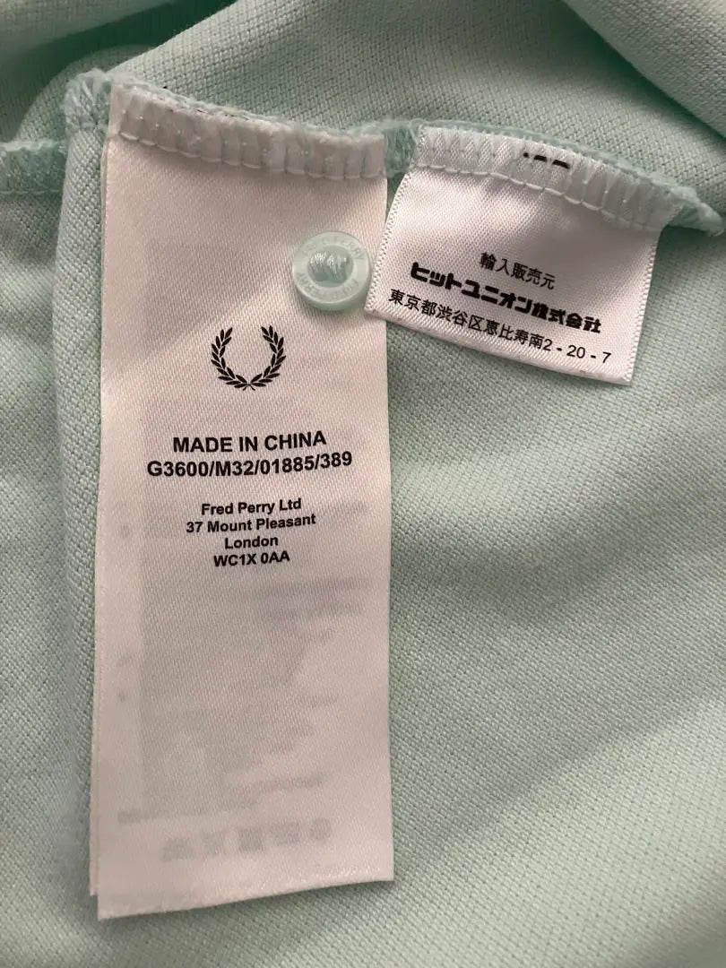 Polo de golf elástico de manga corta Fred Perry en verde menta