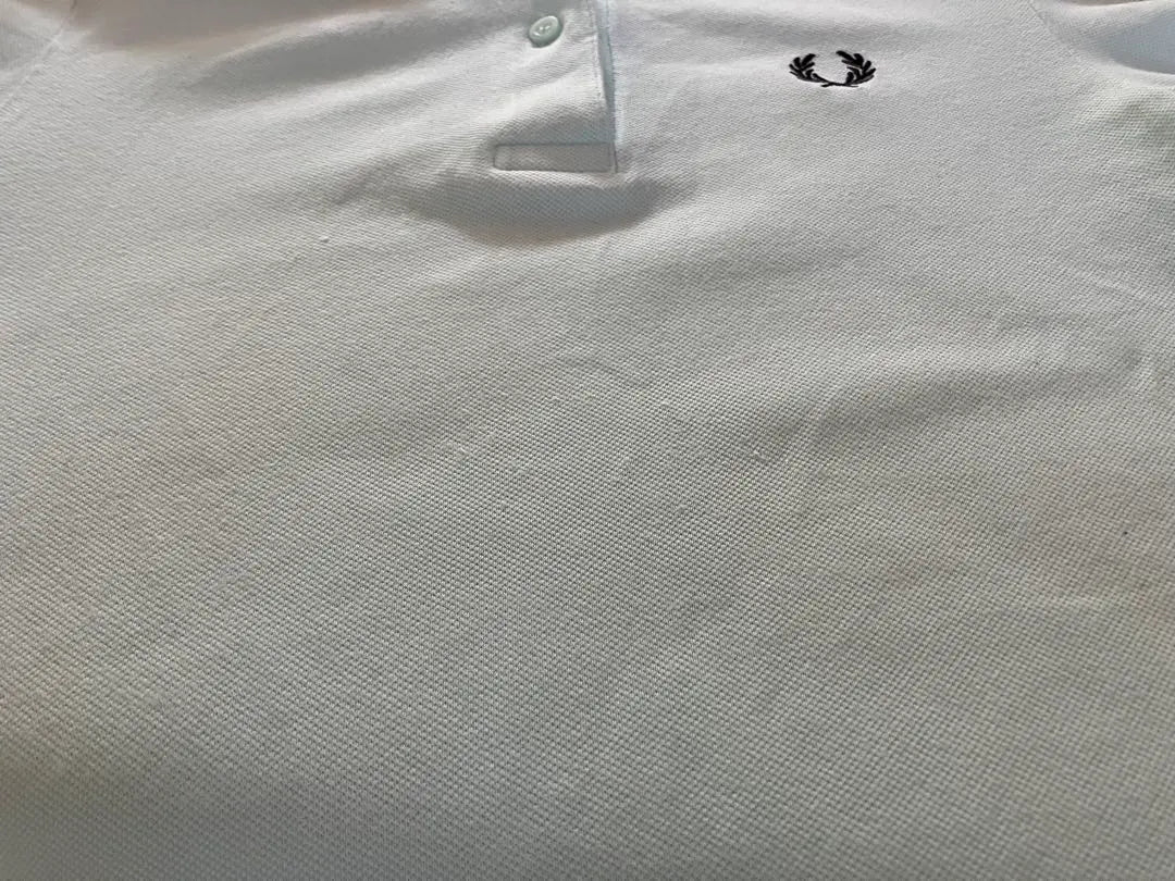 Polo de golf elástico de manga corta Fred Perry en verde menta