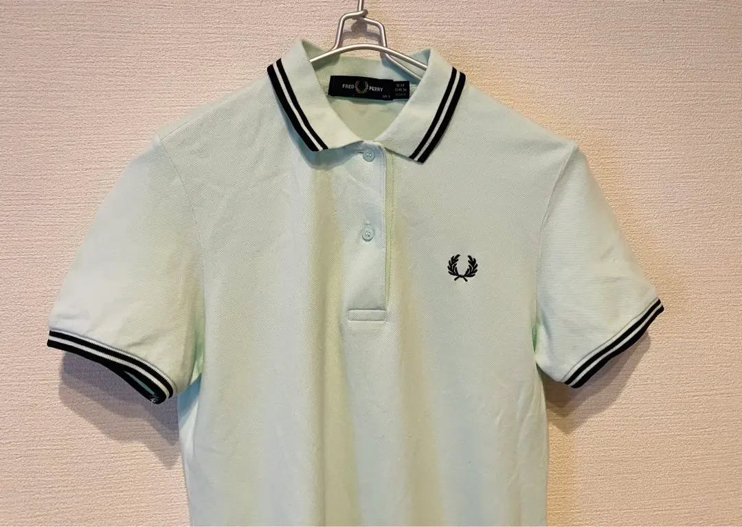 Polo de golf elástico de manga corta Fred Perry en verde menta