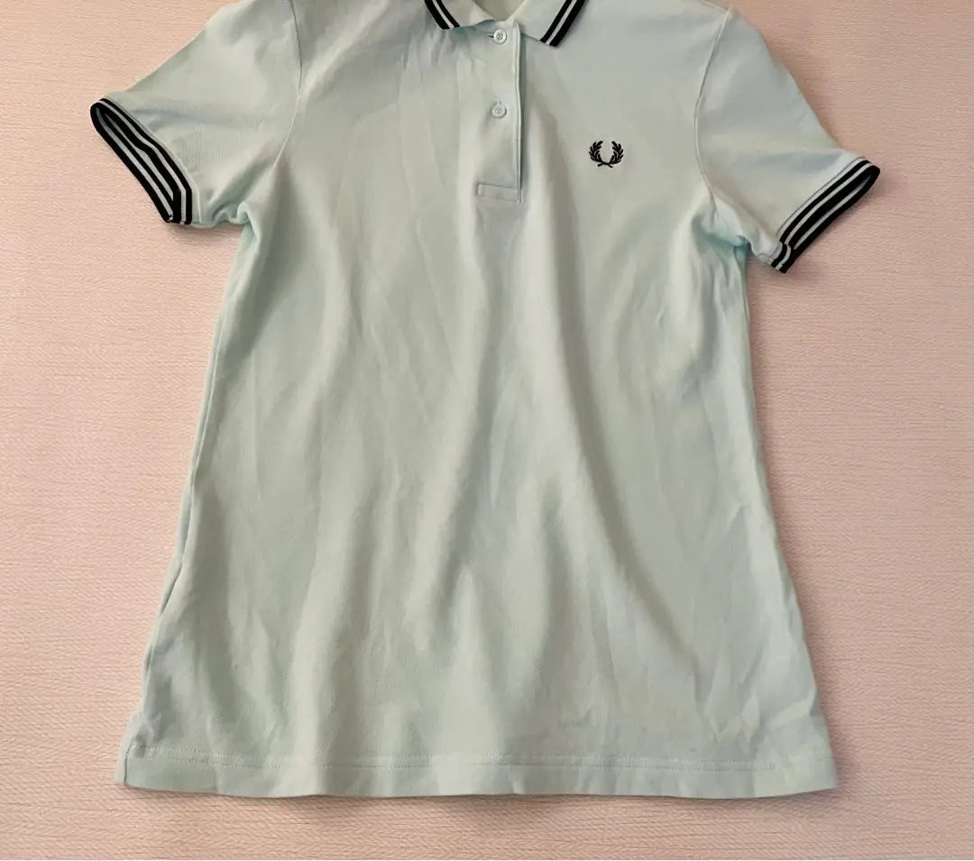 Polo de golf elástico de manga corta Fred Perry en verde menta