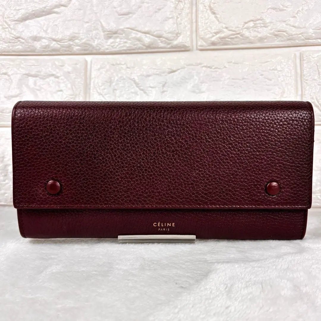 Hermosa cartera larga Celine con solapa multifunción grande color rojo burdeos