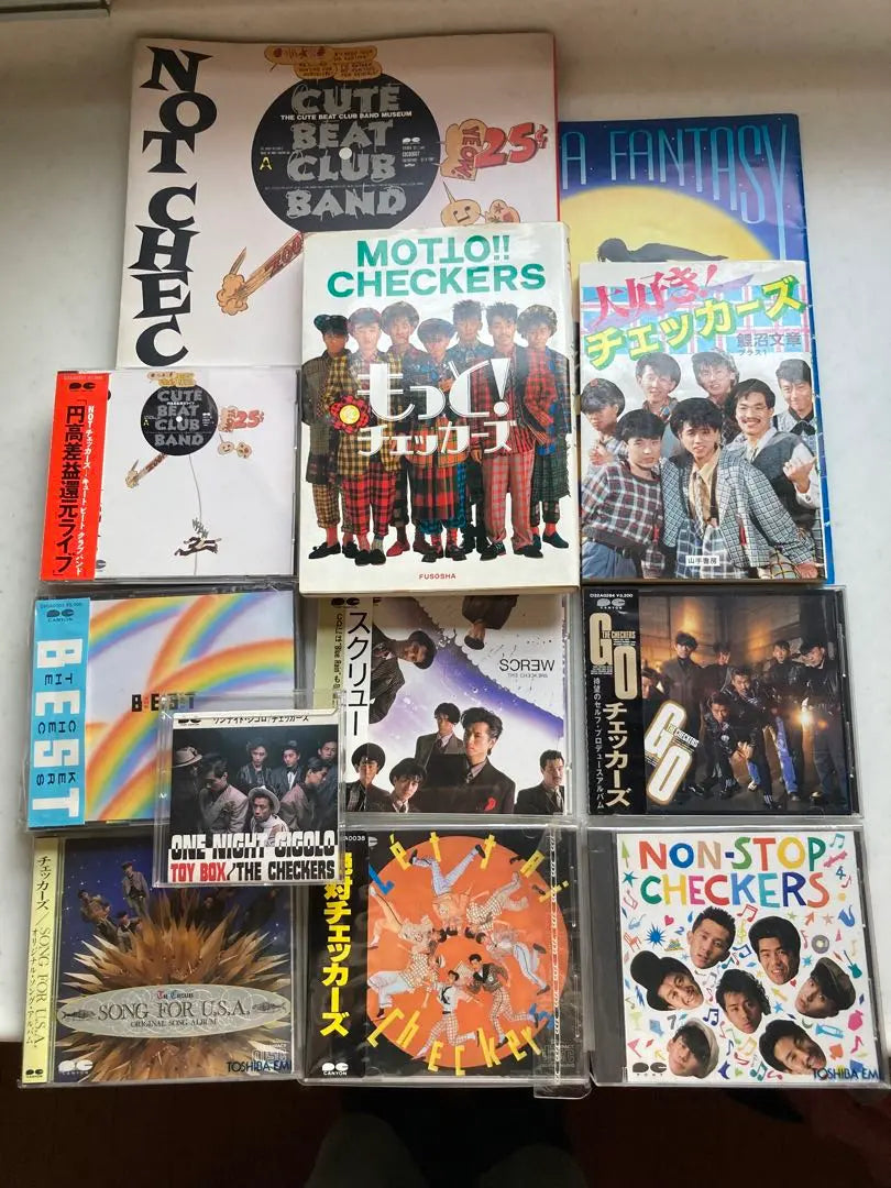 Checkers Photobook, hardcover, 7 CDs, single CDs, and more