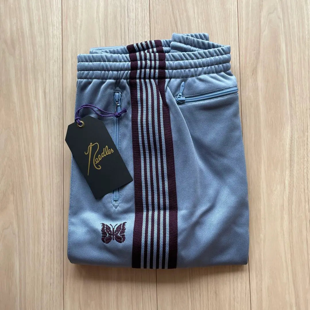 Brand new, unused needles track pants, sax blue