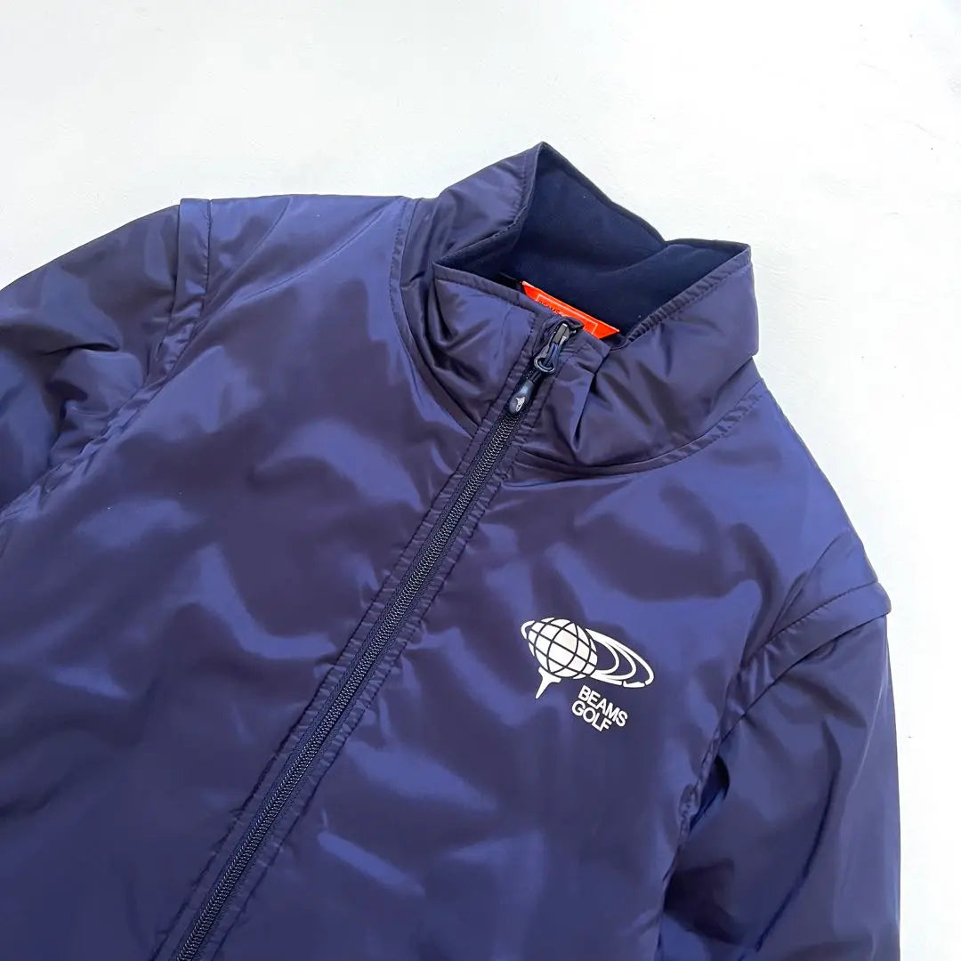 BEAMS GOLF Chaqueta de plumón de algodón Beam Sugorf Logo Hombre | BEAMS GOLF ビームスゴルフ 中綿入り ダウンジャケット メンズ ロゴ