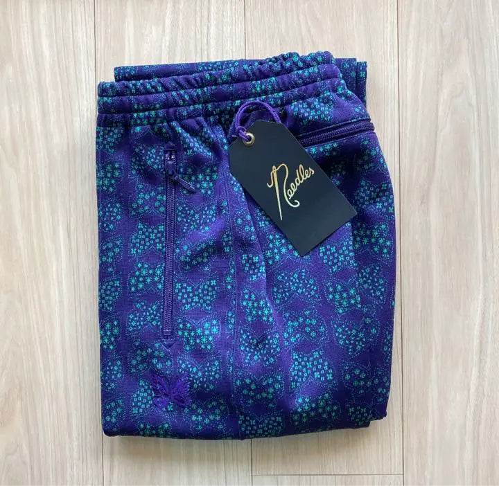 Nuevos pantalones de chándal NEEDLES sin usar Total Pattern Papillon Purple | 新品未使用 agujas トラックパンツ 総柄 パピヨン パープル