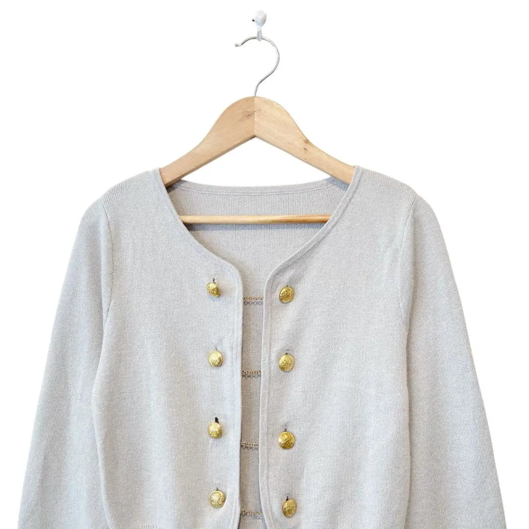 Short cardigan with gold chain button