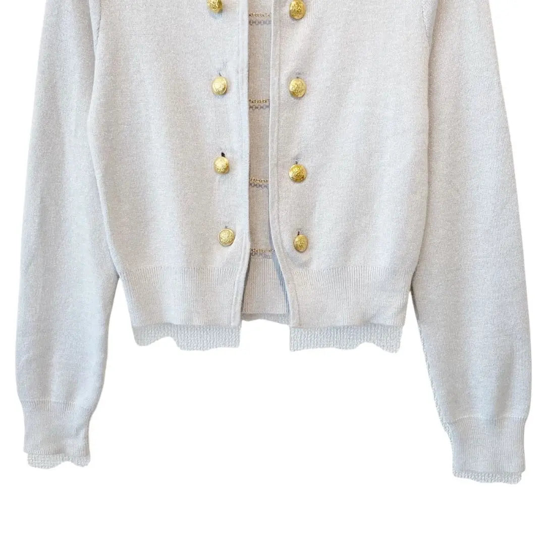 Short cardigan with gold chain button