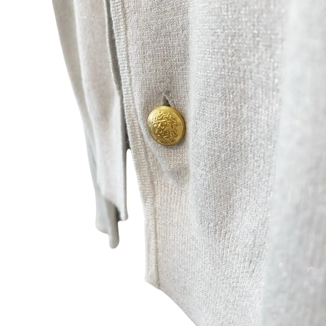 Short cardigan with gold chain button