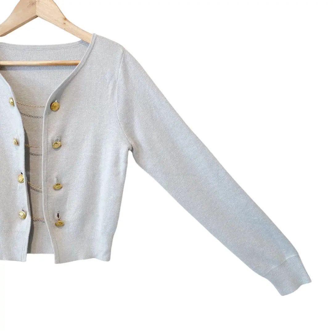 Short cardigan with gold chain button