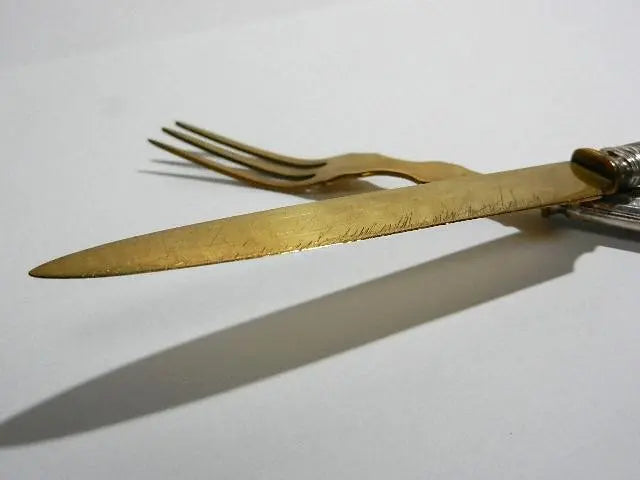 Beautiful brass knives and forks (for desserts and hors d'oeuvres)