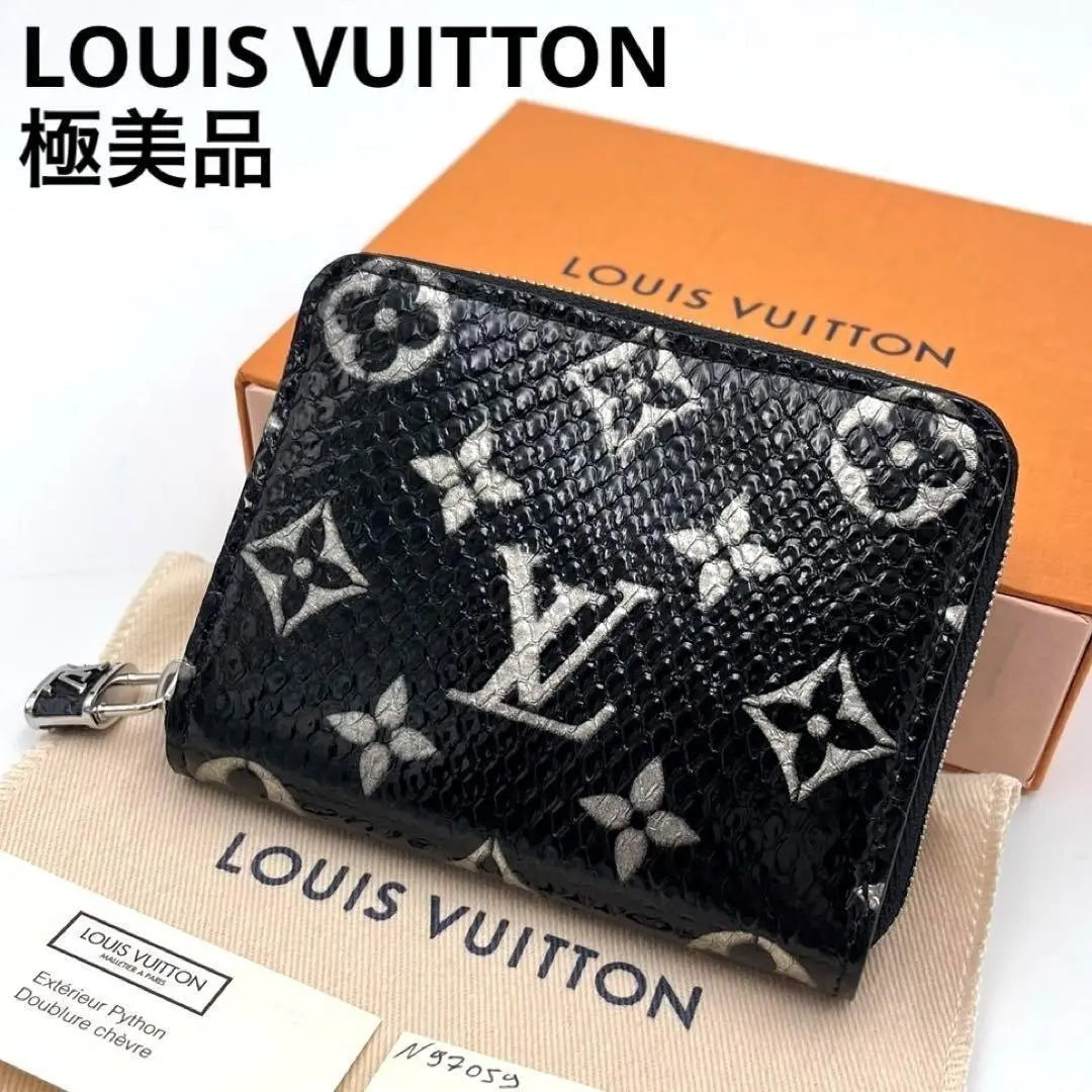 Monedero con cremallera exótico Monogram de Louis Vuitton, en excelente estado, raro y en color negro