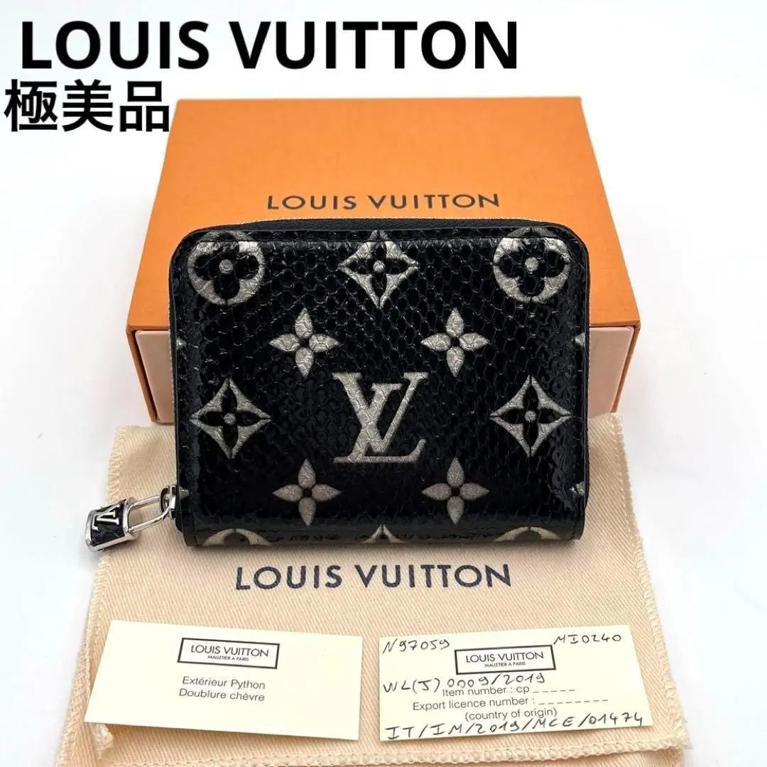 Monedero con cremallera exótico Monogram de Louis Vuitton, en excelente estado, raro y en color negro