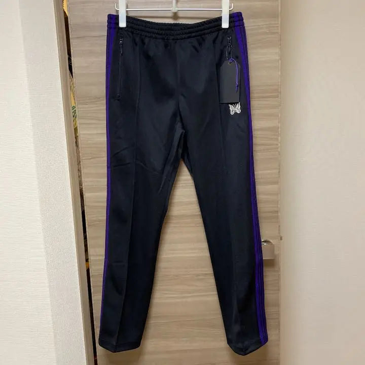 Brand new, unused needles track pants, narrow purple, black