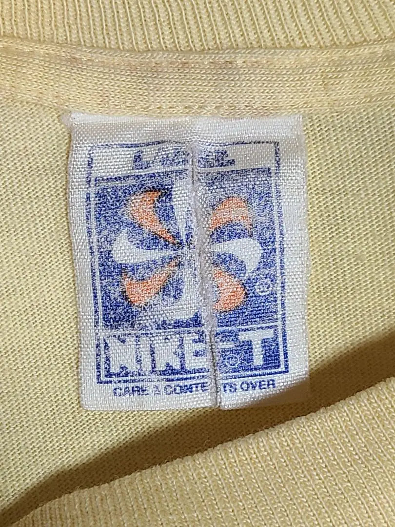 Etiqueta de molino de viento. Camiseta larga NIKE de los años 70 en amarillo limón talla L Gotsu Nike