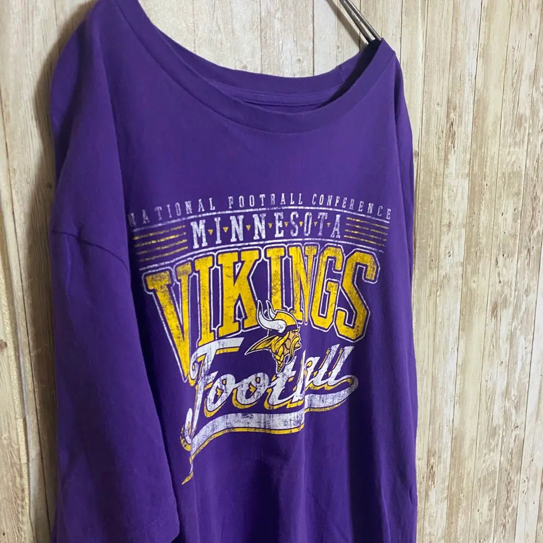 [B59] Camiseta con estampado de logotipo grande del equipo Minnesota Vikings de la NFL