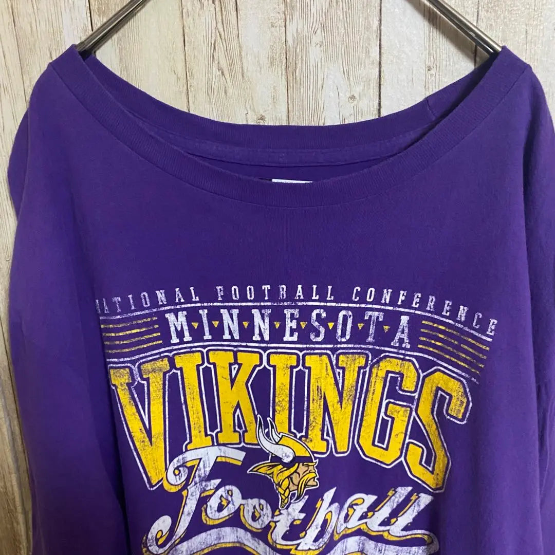 [B59] Camiseta con estampado de logotipo grande del equipo Minnesota Vikings de la NFL