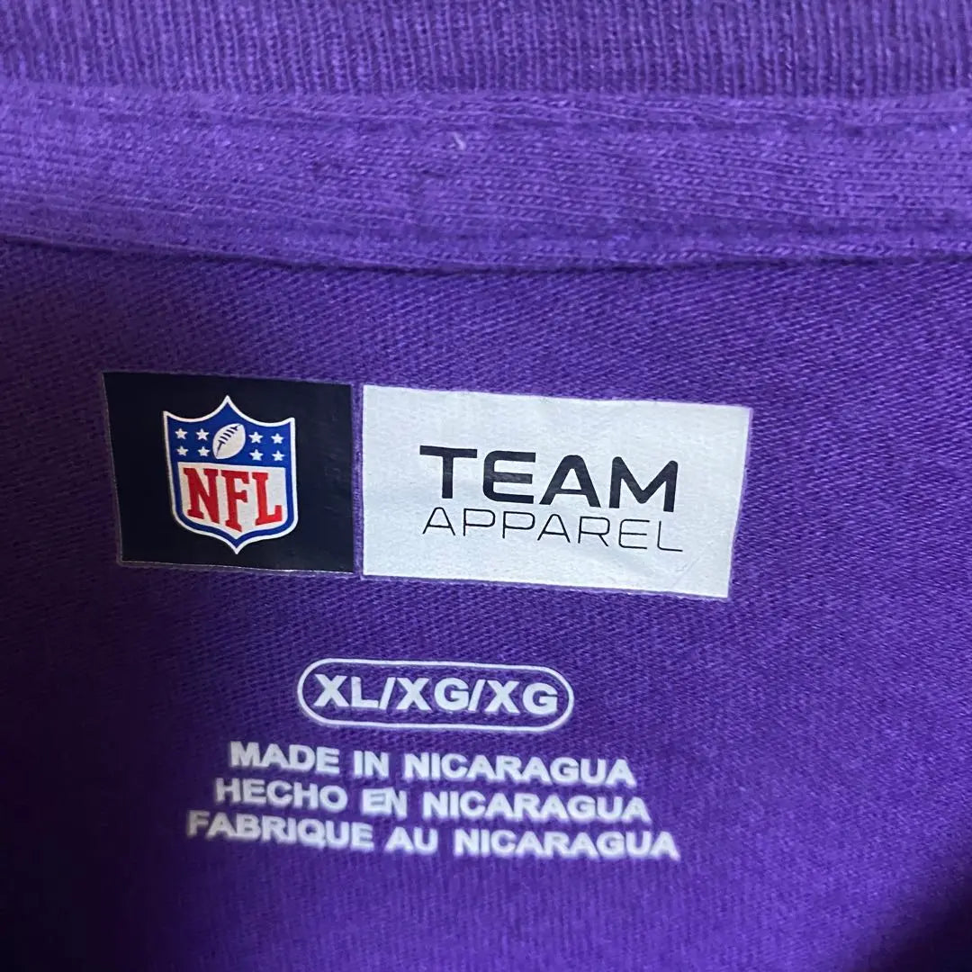 [B59] Camiseta con estampado de logotipo grande del equipo Minnesota Vikings de la NFL