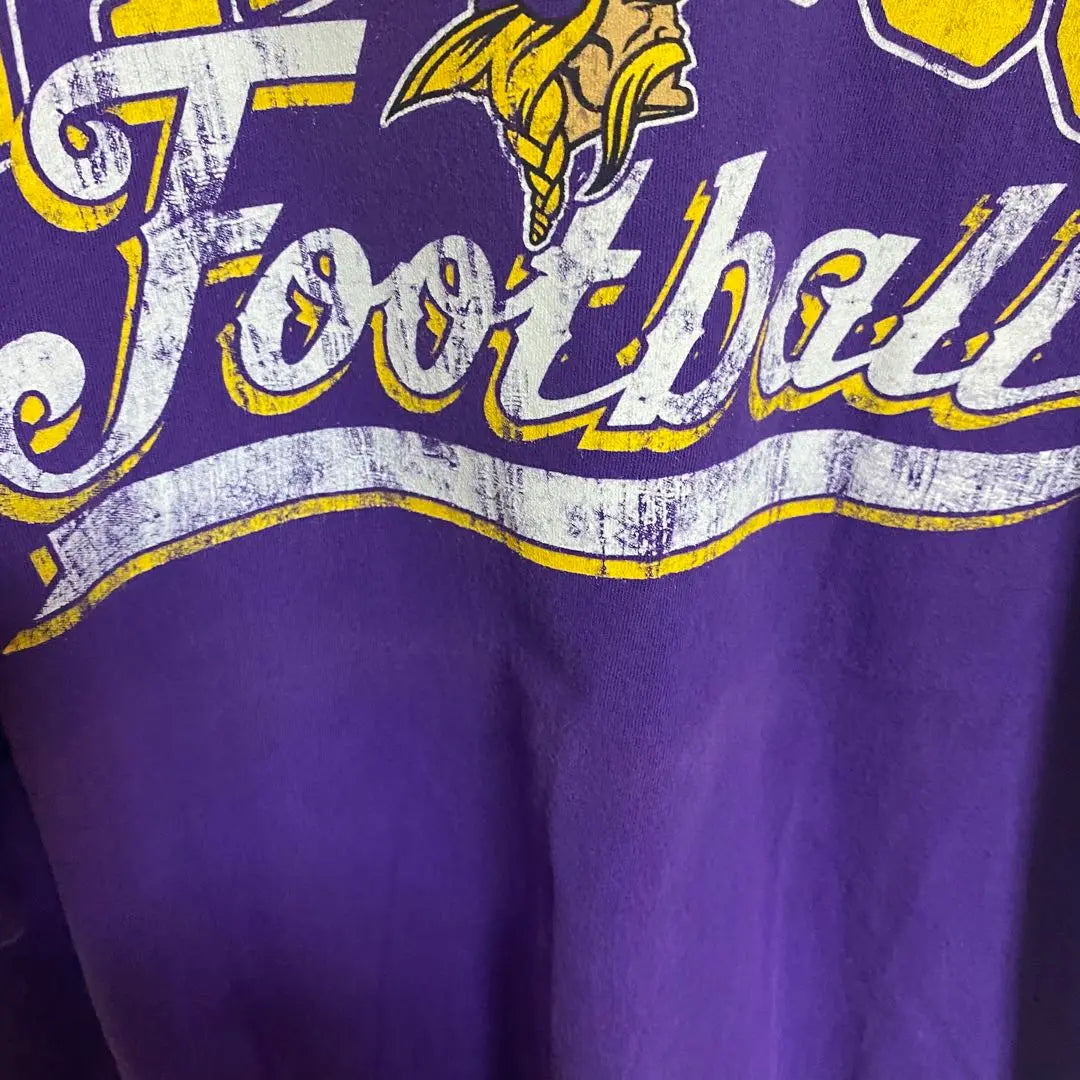 [B59] Camiseta con estampado de logotipo grande del equipo Minnesota Vikings de la NFL