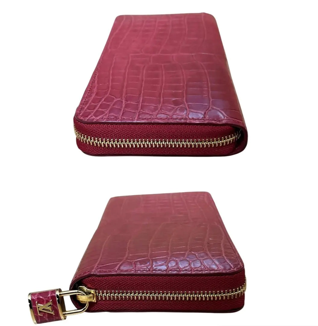 Cartera Louis Vuitton con cremallera y diseño de cocodrilo, en excelente estado y poco común, larga, color rojo