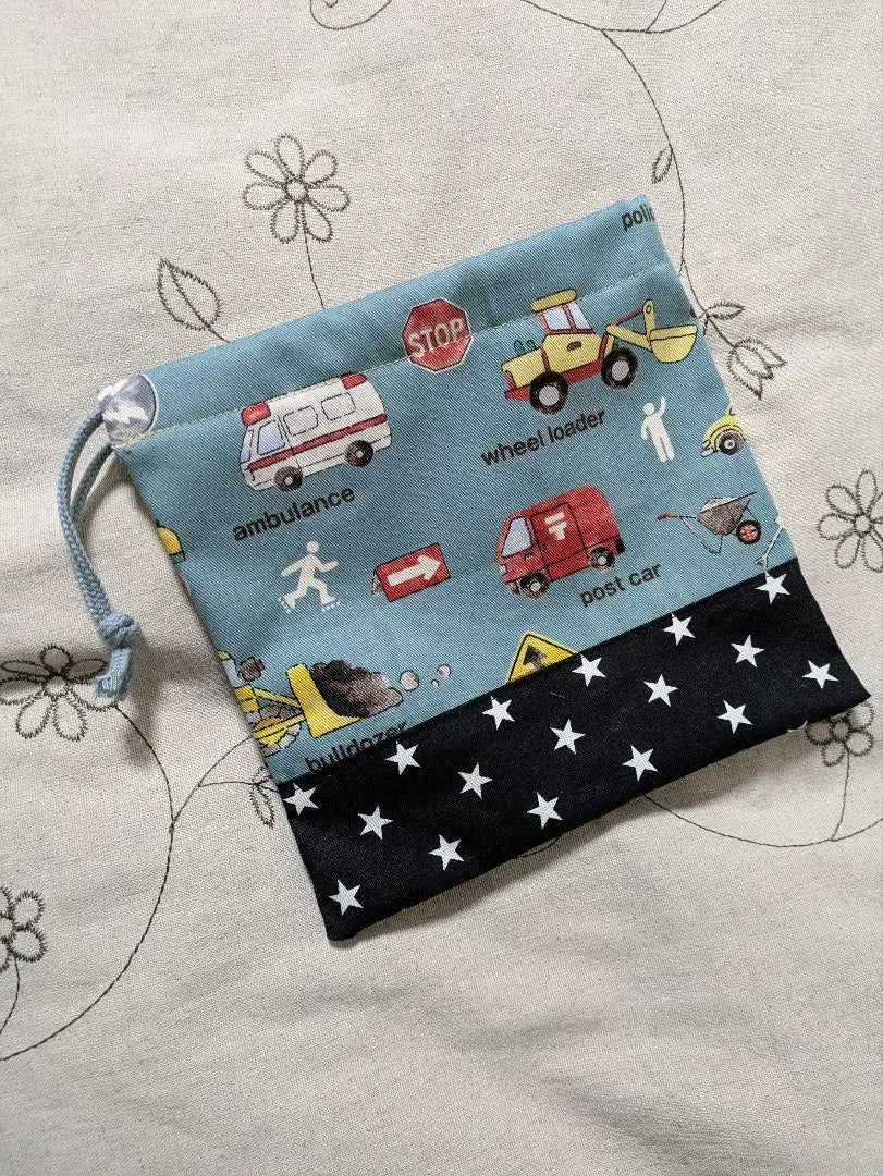 Bolso de mano con cordón para niño con diseño de estrella en blanco y negro y coche de trabajo